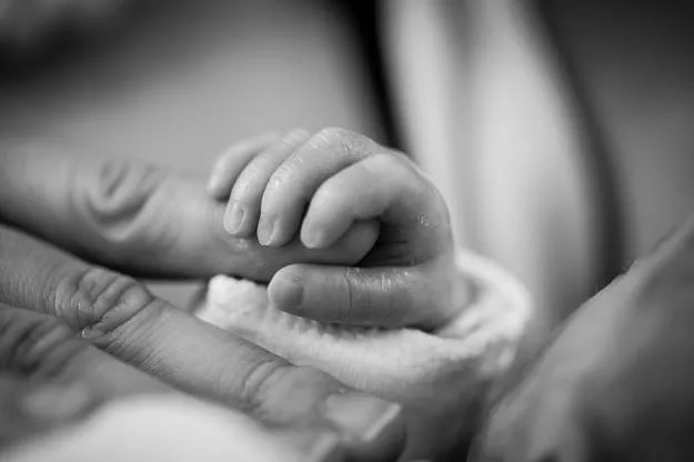 A night nurse caring for a newborn